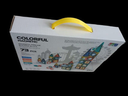 Box of Colorful Magentic magnetic line building blocks with a yellow handle on a black background