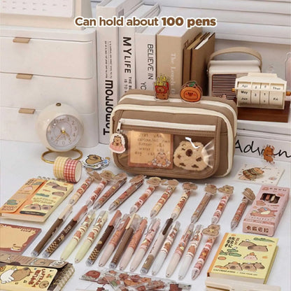 A multi compartment pencil box filled with numerous pens and stationery, demonstrating its large capacity. The ultimate pencil bag.