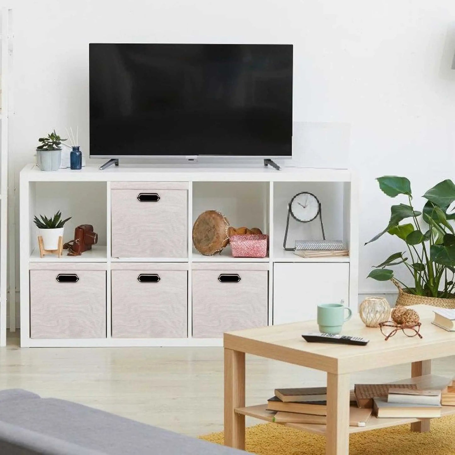 Collapsible storage box in a modern living room, showcasing folding boxes storage for books & decor.