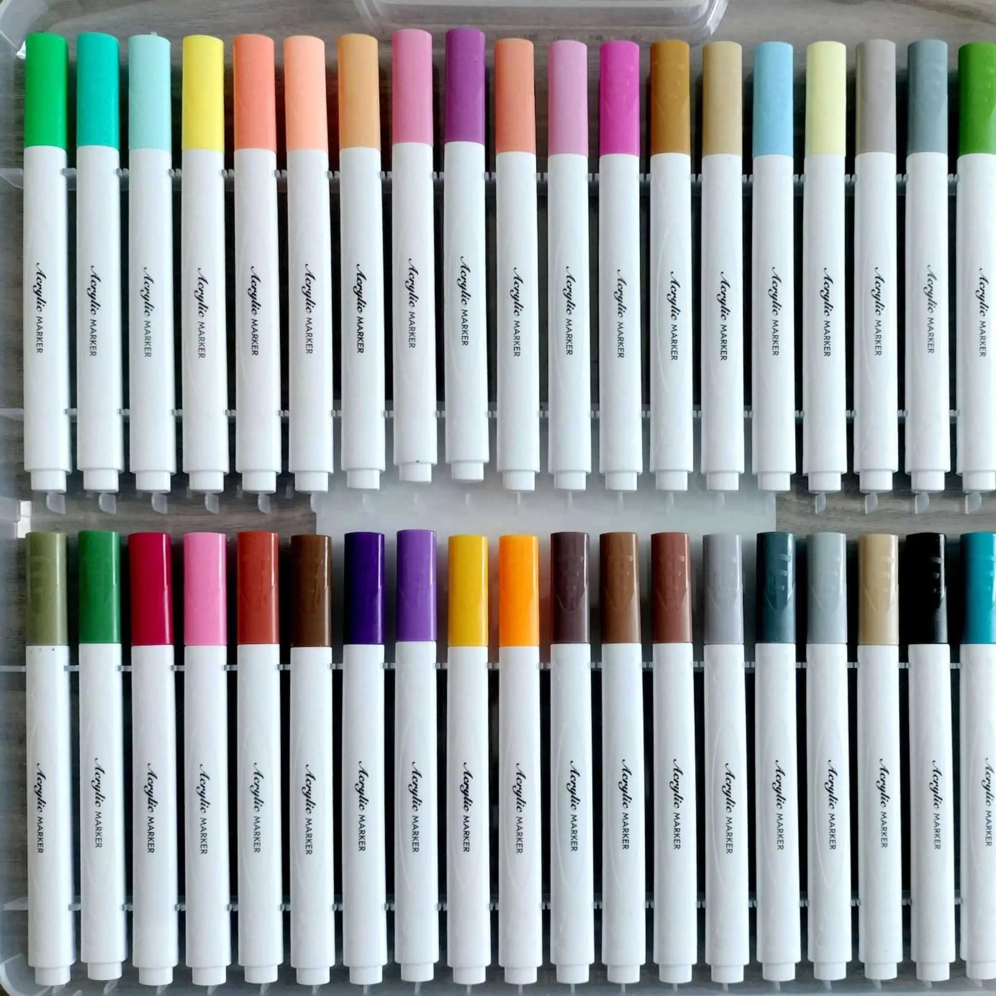 Close-up acrylic marker set with 80 vibrant pastel and bold acrylic paint markers.