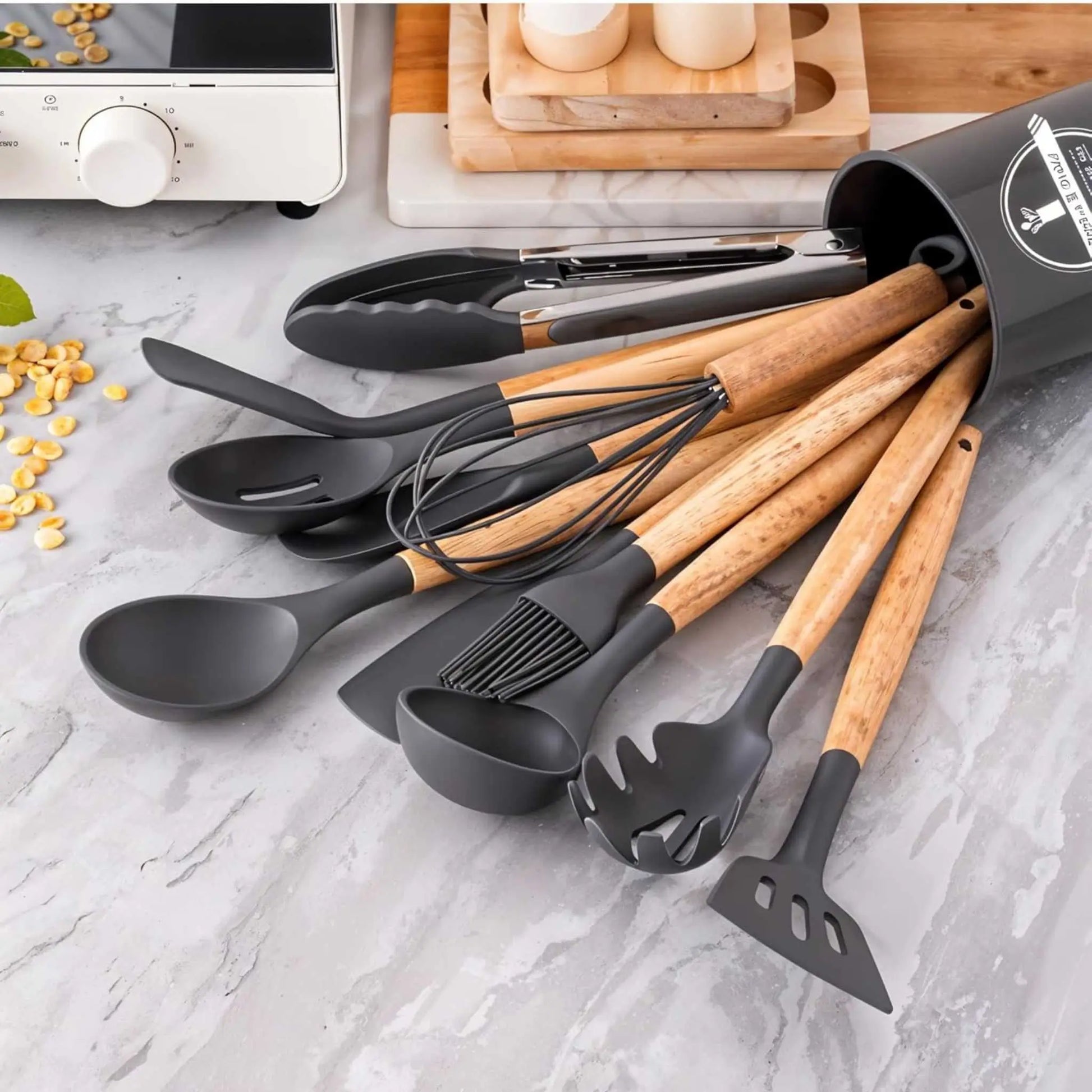 Spilled grey silicone utensil set with wood handles; shows the durability of this best utensil set for any kitchen.