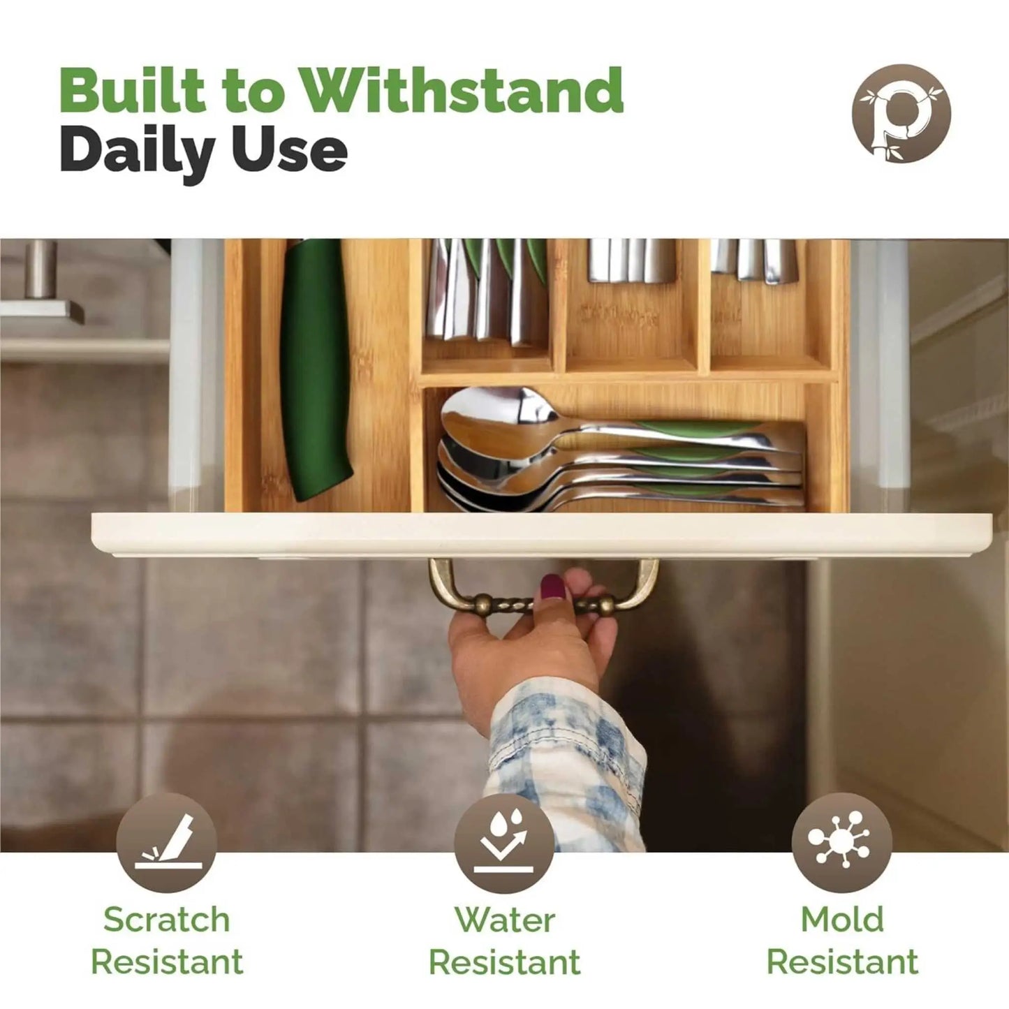 Hand reveals scratch & water-resistant bamboo kitchen drawer organiser. Essential for any cutlery tray and drawer organizer needs.