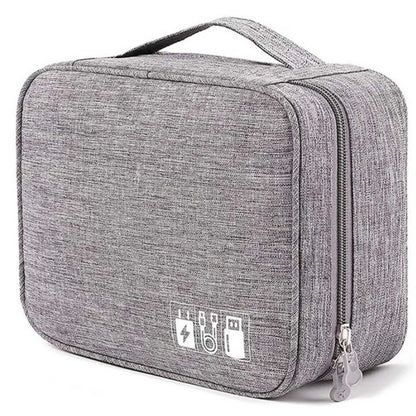 Grey double-layer cord organiser travel bag, ideal electronic organizer travel case for cables & accessories. Features top handle, zipper.