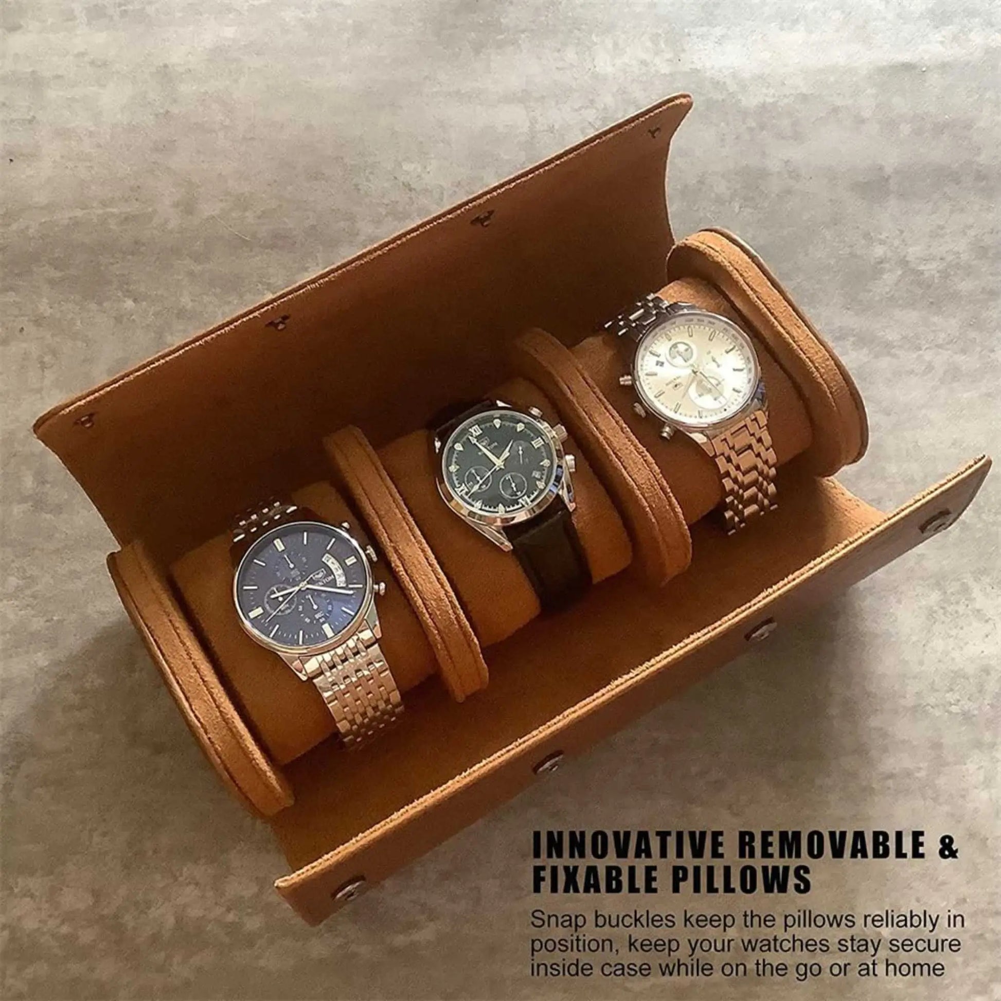 Open brown leather watch roll displaying 3 men's wristwatches secured on removable cushions.